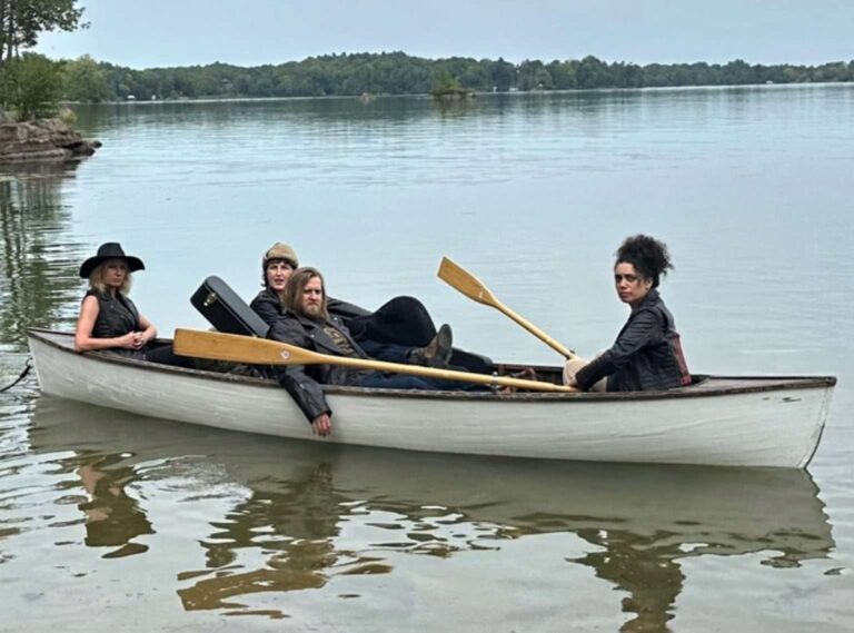 Doom Boogie featured image of band in a boat on a lake. Photo by J. Joly. September 2024.