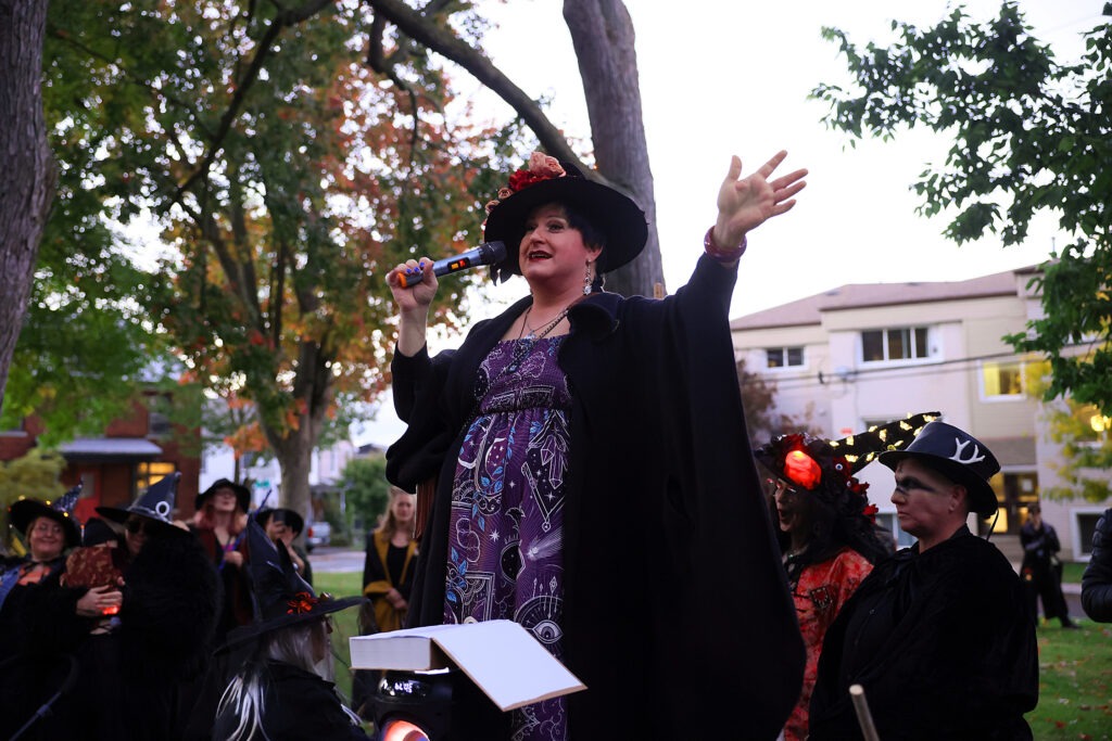 Tyffanie casting a spell at the Kingston Witches Walk 2026